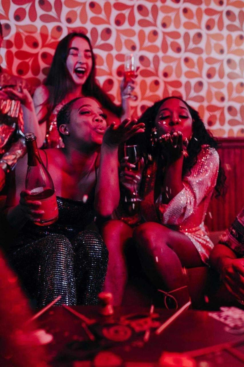 Women celebrating and partying at a night out concert event